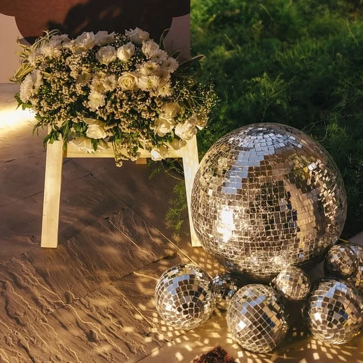 Disco balls and white roses for the sangeet night